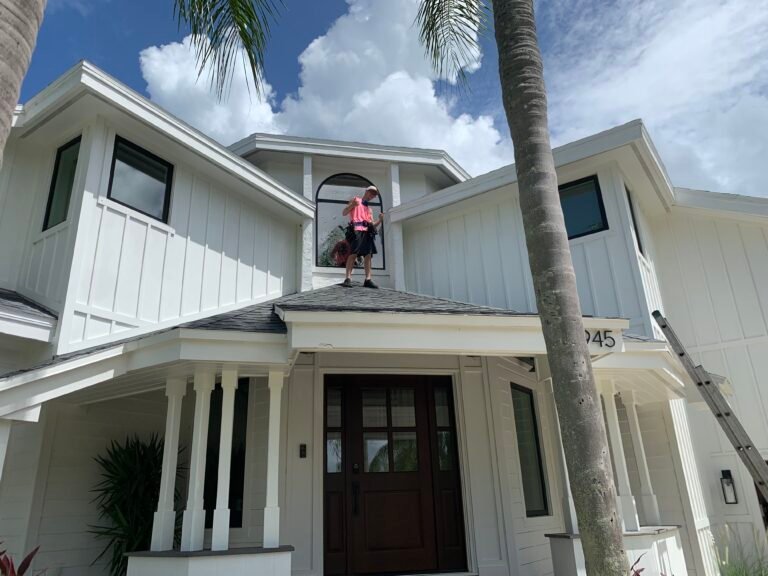 Residential window film project on a white two-story home in Apollo Beach Florida