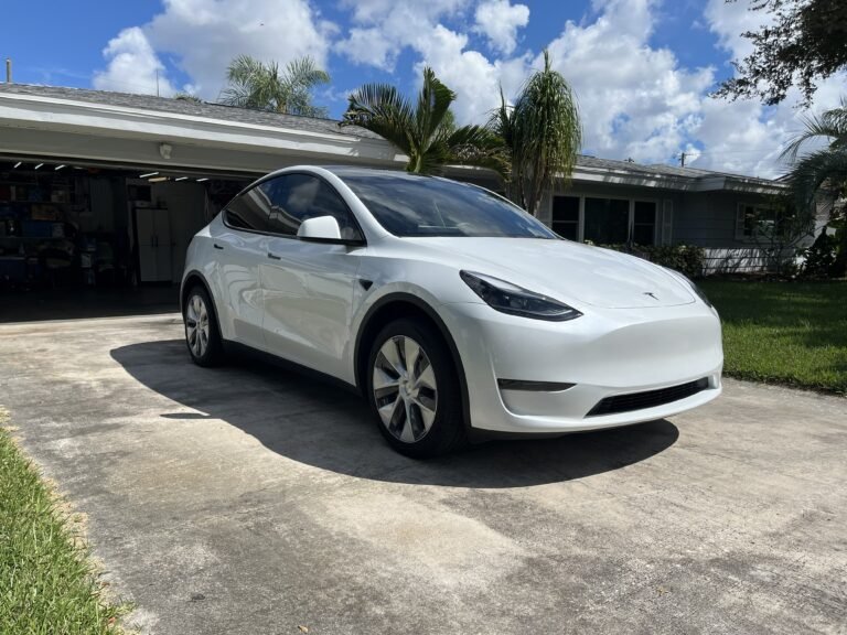 White Tesla Model Y with ceramic automotive window tint installed in St. Petersburg Florida