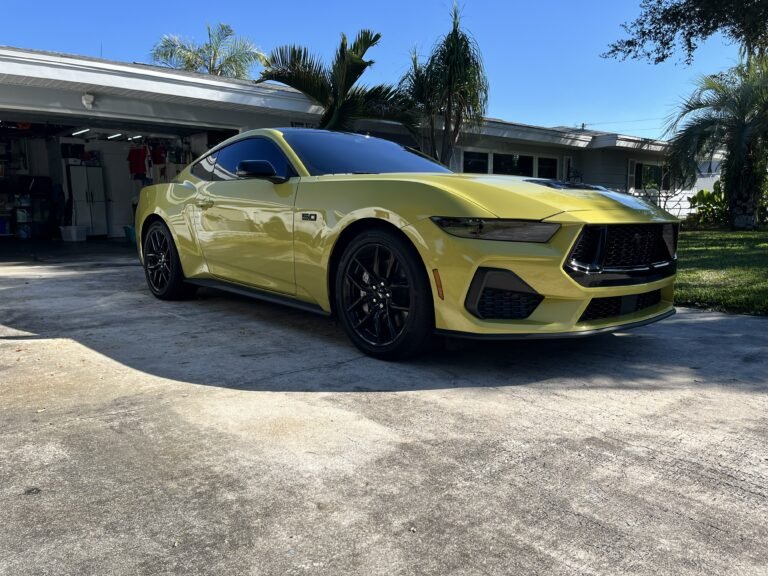 Yellow Ford Mustang with ceramic window tint installed by Tint by the Bay in St. Petersburg Florida