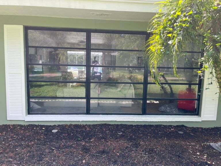 Residential window film installed on large home windows for glare and heat reduction